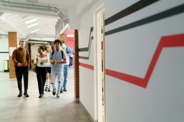 students walking in school hallway