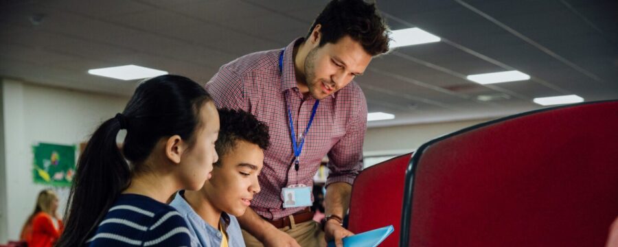 teacher helping students