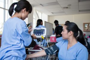 medical students using blood pressure machine
